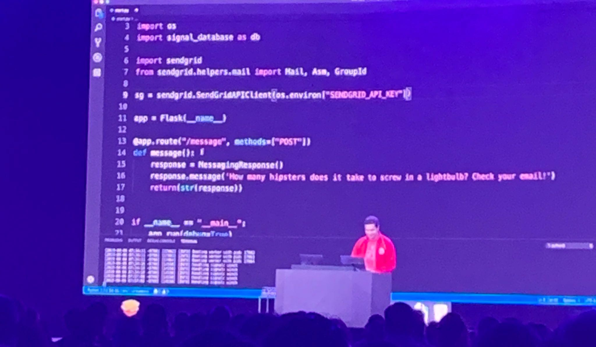 Marcos Placona demoing on stage at SIGNAL with his favoritest programming language ever, Python.